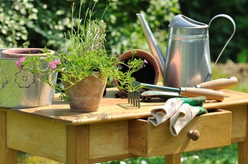 Team member preparing tools at a garden site
